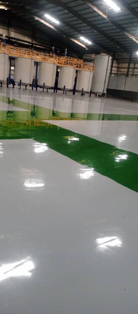 Freshly poured high-gloss epoxy floor on a commercial site in Ogun State